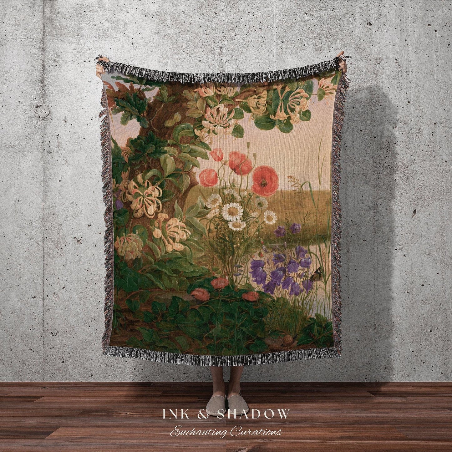 a tapestry hanging on a wall with a woman standing in front of it