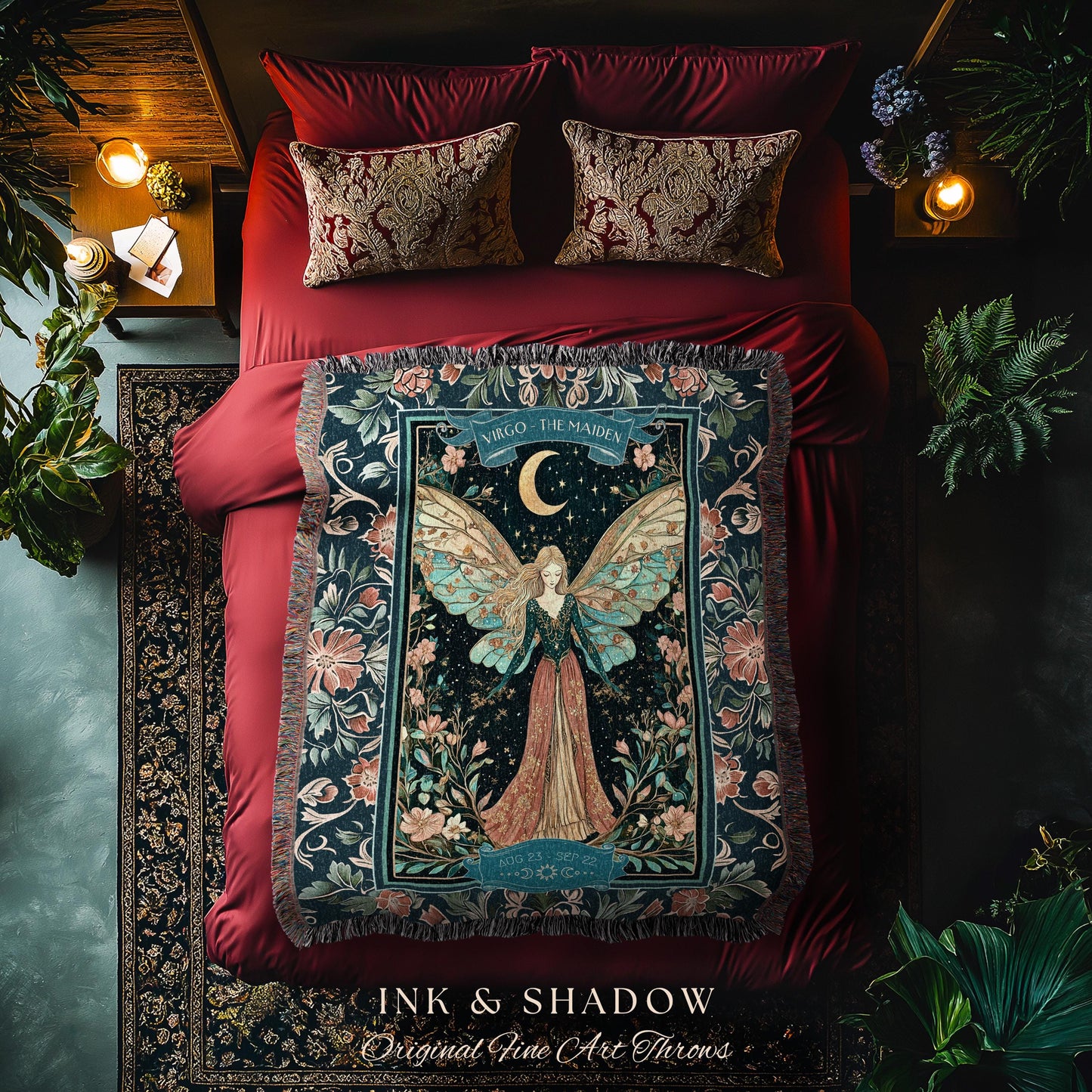 May include: A woven tapestry throw blanket with a dark blue background and a floral design. The center of the blanket features a fairy with wings and a crescent moon. The text on the blanket reads 'Virgo - The Maiden' and 'Ink & Shadow Original Fine Art Throws'.