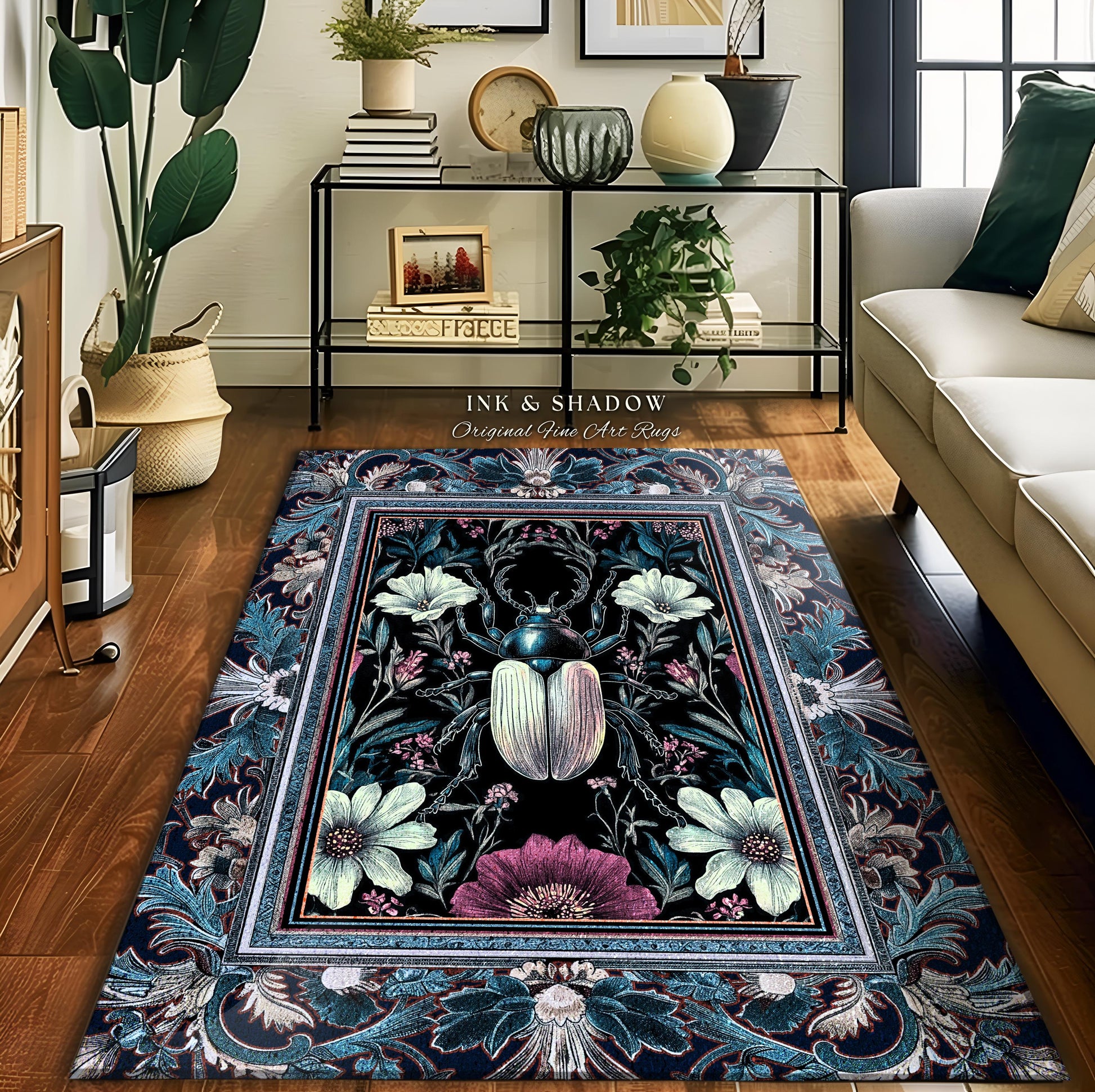 May include: A dark teal rug with a framed floral design featuring a large beetle in the center. The rug has a vintage, ornate border. The text &#39;INK & SHADOW Original Fine Art Rugs&#39; is visible. The rug&#39;s color palette consists of deep blues, greens, purples, and creams.