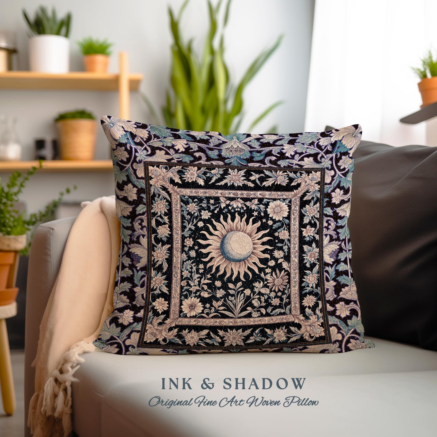 May include: A square throw pillow with a black background and a woven design of a sun and moon in a floral frame. The pillow has a white border and the text &#39;INK & SHADOW Original Fine Art Woven Pillow&#39; is printed below the pillow.