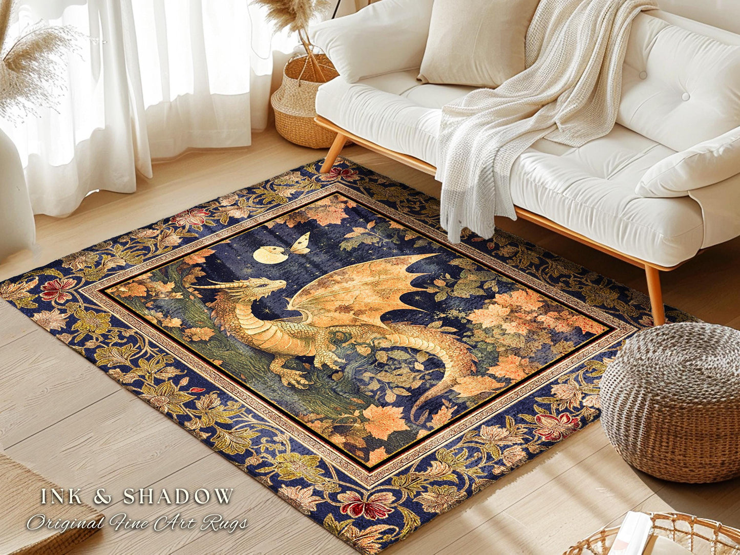 May include: A blue and gold rug with a dragon design. The rug has a dark blue background with gold accents. The dragon is in the center of the rug and is facing to the right. The dragon has a long tail and wings. The rug is surrounded by a border of gold and blue flowers. The rug is on a wooden floor. The text &#39;INK & SHADOW Original Fine Art Rugs&#39; is in the lower left corner of the rug.