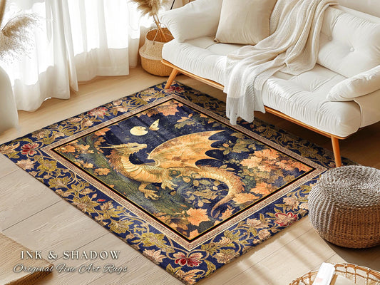May include: A blue and gold rug with a dragon design. The rug has a dark blue background with gold accents. The dragon is in the center of the rug and is facing to the right. The dragon has a long tail and wings. The rug is surrounded by a border of gold and blue flowers. The rug is on a wooden floor. The text &#39;INK & SHADOW Original Fine Art Rugs&#39; is in the lower left corner of the rug.