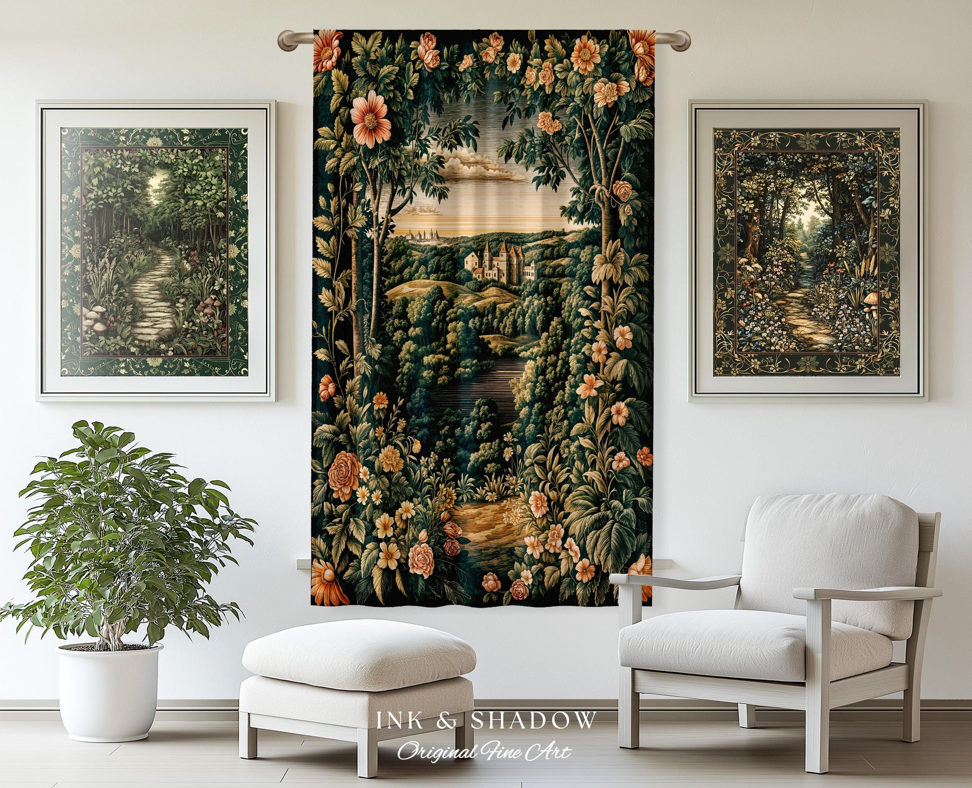 May include: A tapestry with a floral design and a landscape scene in the center. The tapestry is hanging on a wall in a room with a white chair, a white ottoman, and a green plant. The tapestry has a dark green background with pink and yellow flowers. The landscape scene shows a river flowing through a forest with a castle in the distance. The tapestry has the text &#39;INK & SHADOW Original Fine Art&#39; at the bottom.