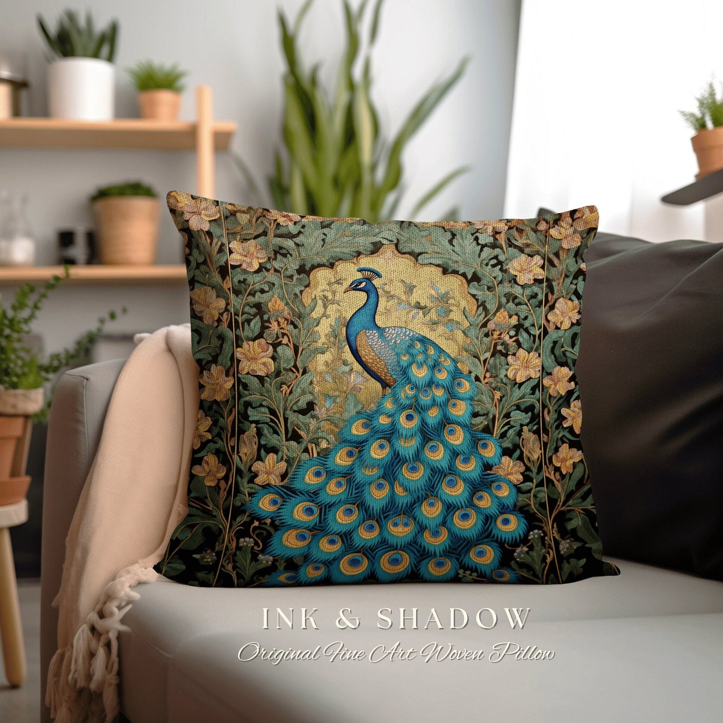 May include: Teal and gold peacock fine art woven pillow. The square pillow features an intricately woven design of a peacock with its tail feathers spread wide. The background is dark with floral accents.  The text 'INK & SHADOW Original Fine Art Woven Pillow' is displayed below the pillow.