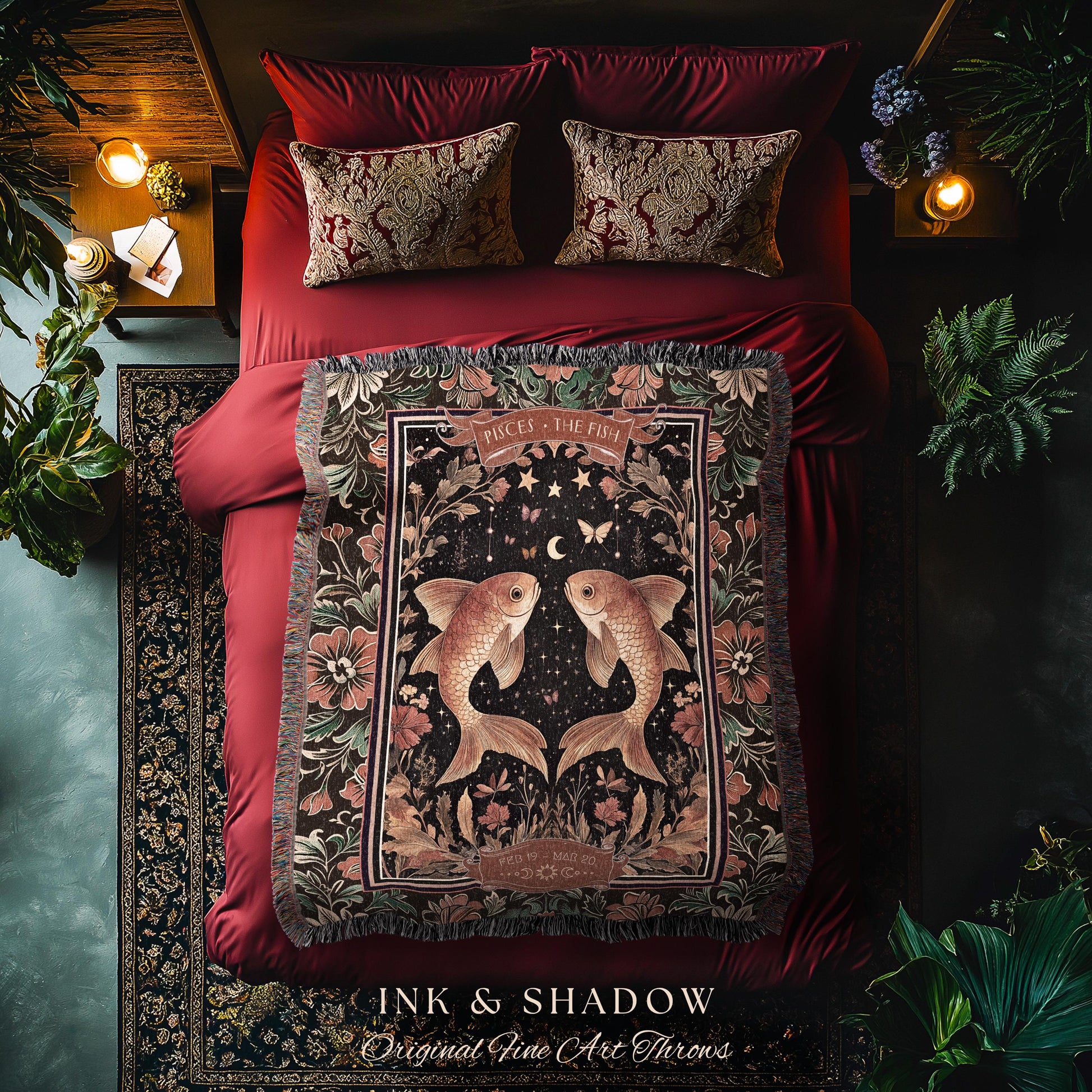 May include: A black and gold woven throw blanket with a tapestry design featuring two gold fish with a crescent moon and stars in the background. The blanket has a fringe border and the text &#39;Pisces - The Fish&#39; in a gold font. The text &#39;Ink & Shadow Original Fine Art Throws&#39; is at the bottom of the blanket.