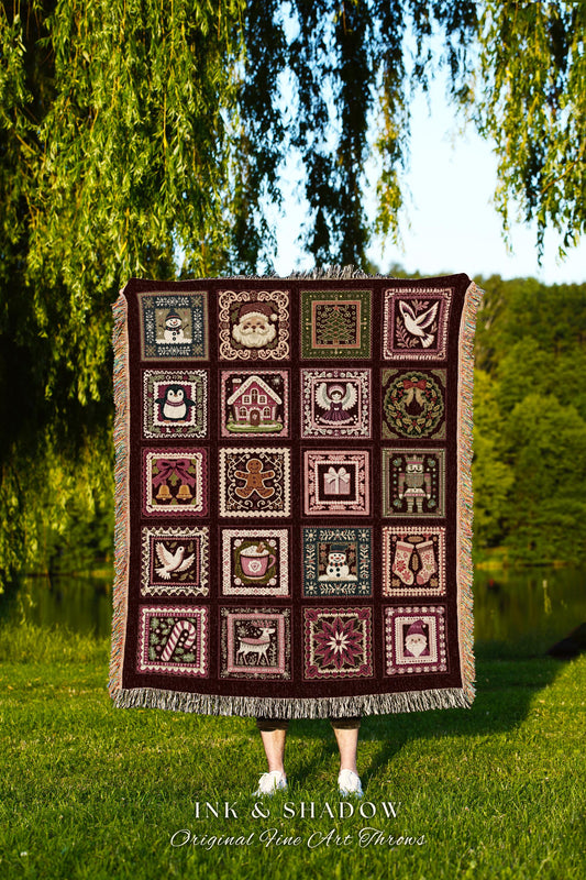 May include: A maroon woven Christmas throw blanket features a tapestry of 25 framed illustrations. Each square depicts a different festive image, including Santa, a Christmas tree, a penguin, gingerbread men, candy canes, and other traditional holiday symbols. The blanket has fringed edges and is displayed against a green lawn with trees in the background. The text &#39;INK & SHADOW Original Fine Art Throws&#39; is visible at the bottom.