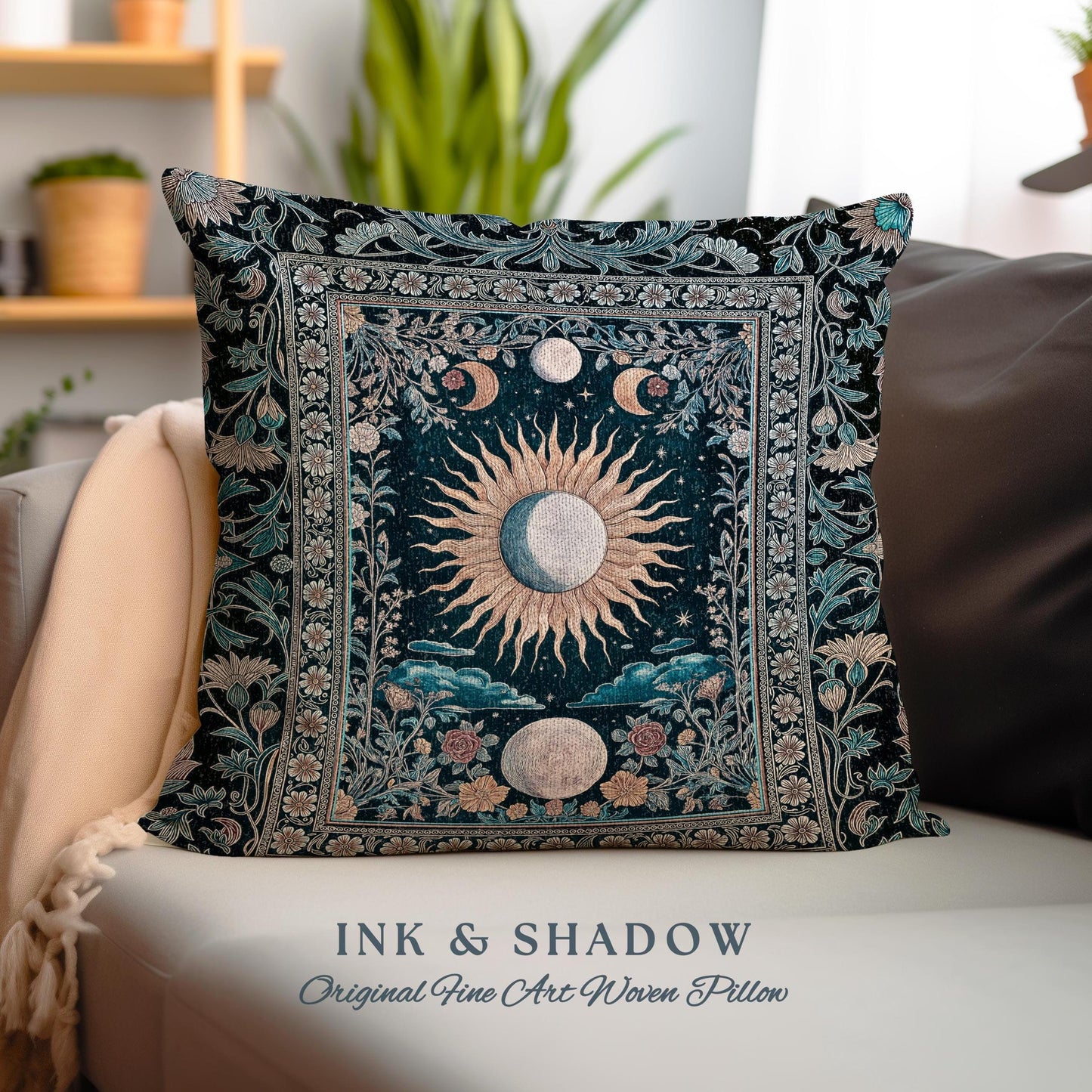 May include: A decorative pillow with a dark blue background featuring a woven tapestry design of a sun and moon with floral accents. The pillow has the text &#39;INK & SHADOW Original Fine Art Woven Pillow&#39; at the bottom.