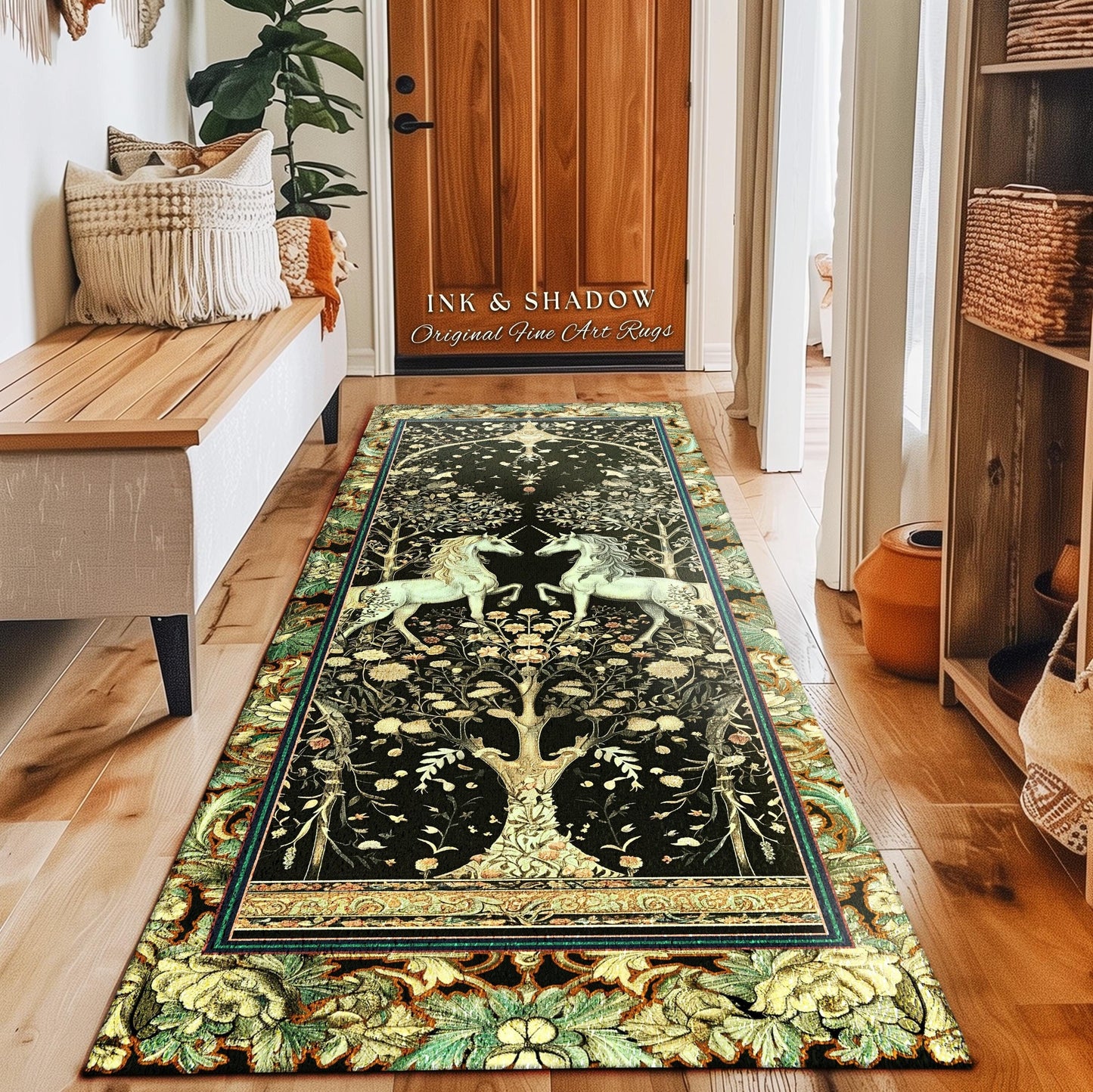 May include: A black and gold runner rug features a tapestry-style design of two unicorns flanking a tree of life. The rug has a detailed border with ornate floral patterns in shades of green and gold.  The text &#39;INK & SHADOW Original Fine Art Rugs&#39; is visible. The rug is displayed in a hallway setting.