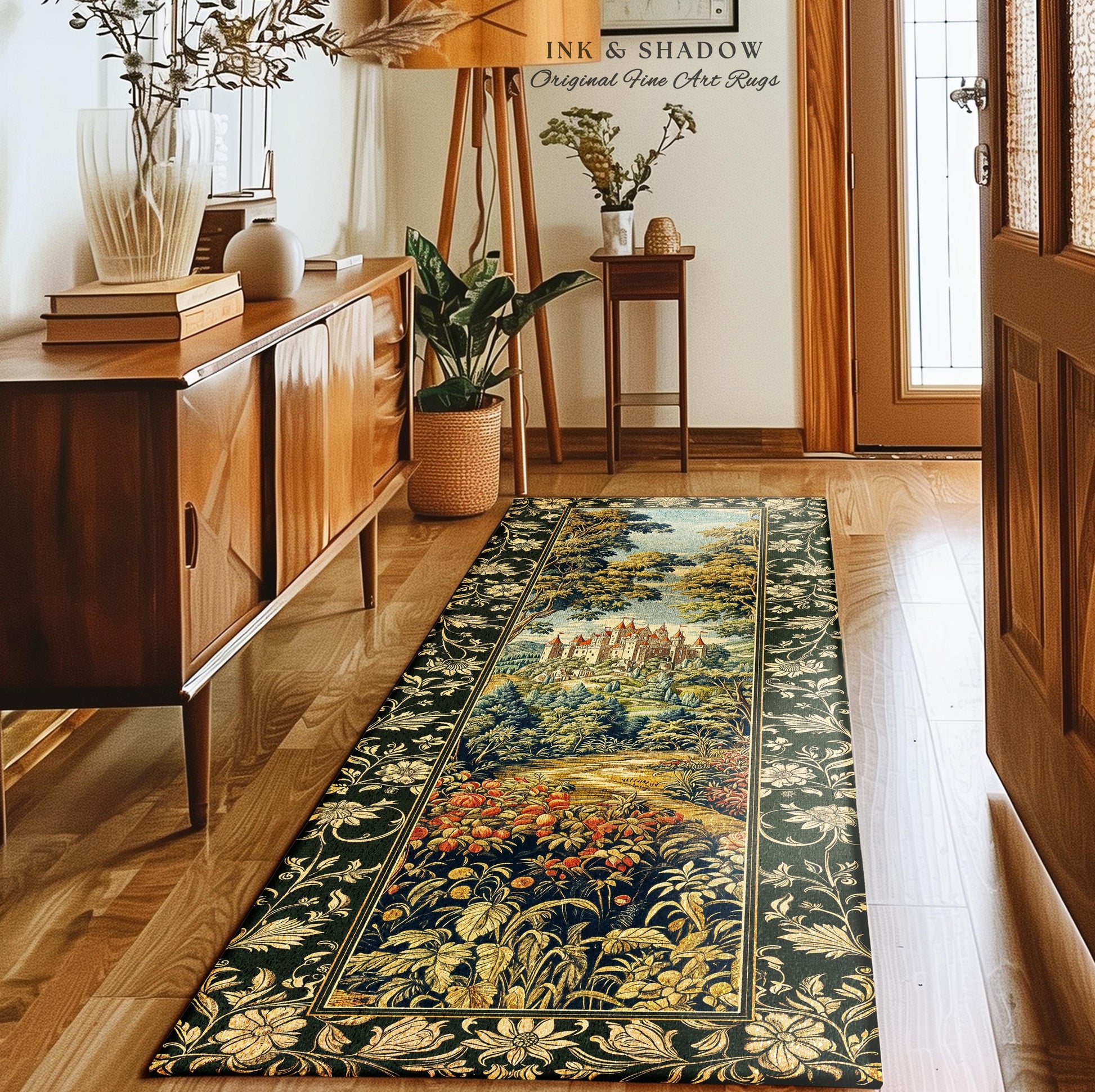 May include: A green and gold tapestry rug with a floral border and a scene of a castle in a forest. The rug is laid out in a hallway with a wooden floor and a wooden cabinet to the left. The text &#39;INK & SHADOW Original Fine Art Rugs&#39; is visible in the top center of the image.