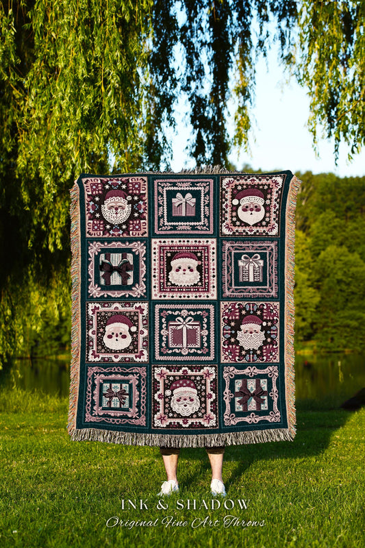 May include: A dark teal woven Christmas throw blanket features a patchwork design of Santa Claus faces and gift boxes in shades of burgundy and cream.  Each motif is framed by a decorative border. The throw has fringed edges. Text at the bottom reads: &#39;INK & SHADOW Original Fine Art Throws&#39;.