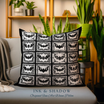 May include: A black and white throw pillow with a repeating pattern of bats in frames. The pillow reads &#39;INK & SHADOW Original Fine Art Woven Pillow&#39;.