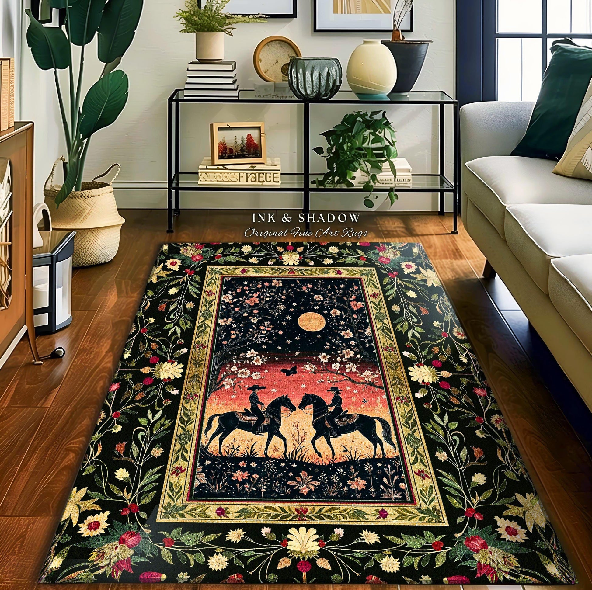 May include: A black and gold area rug with a floral border and a central image of two riders on horseback under a full moon. The rug has the text &#39;INK & SHADOW Original Fine Art Rugs&#39; in the top center.