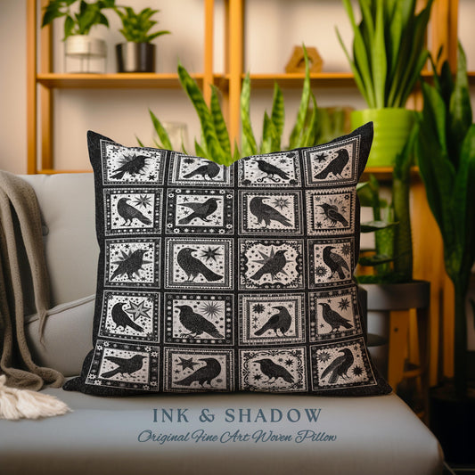 May include: A black and white woven pillow with a repeating pattern of crows and stars. The pillow is on a light blue couch with a throw blanket. The pillow has the text &#39;INK & SHADOW Original Fine Art Woven Pillow&#39; at the bottom.