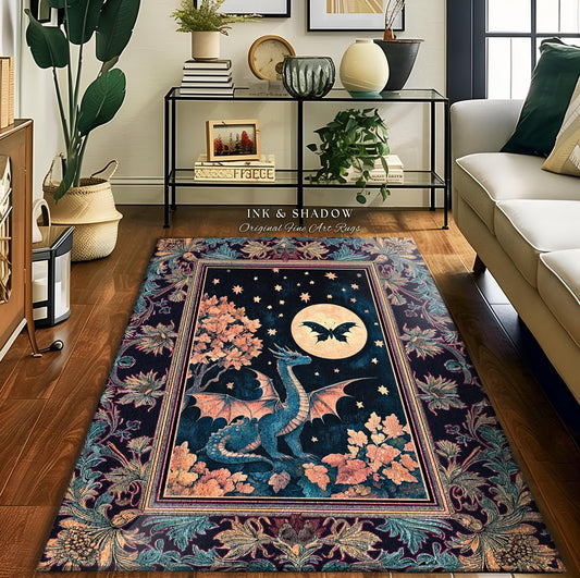 May include: A dark blue rug with a floral border and a central image of a blue dragon with a butterfly in the moon. The rug has a text overlay that reads &#39;Ink & Shadow Original Fine Art Rugs&#39;.