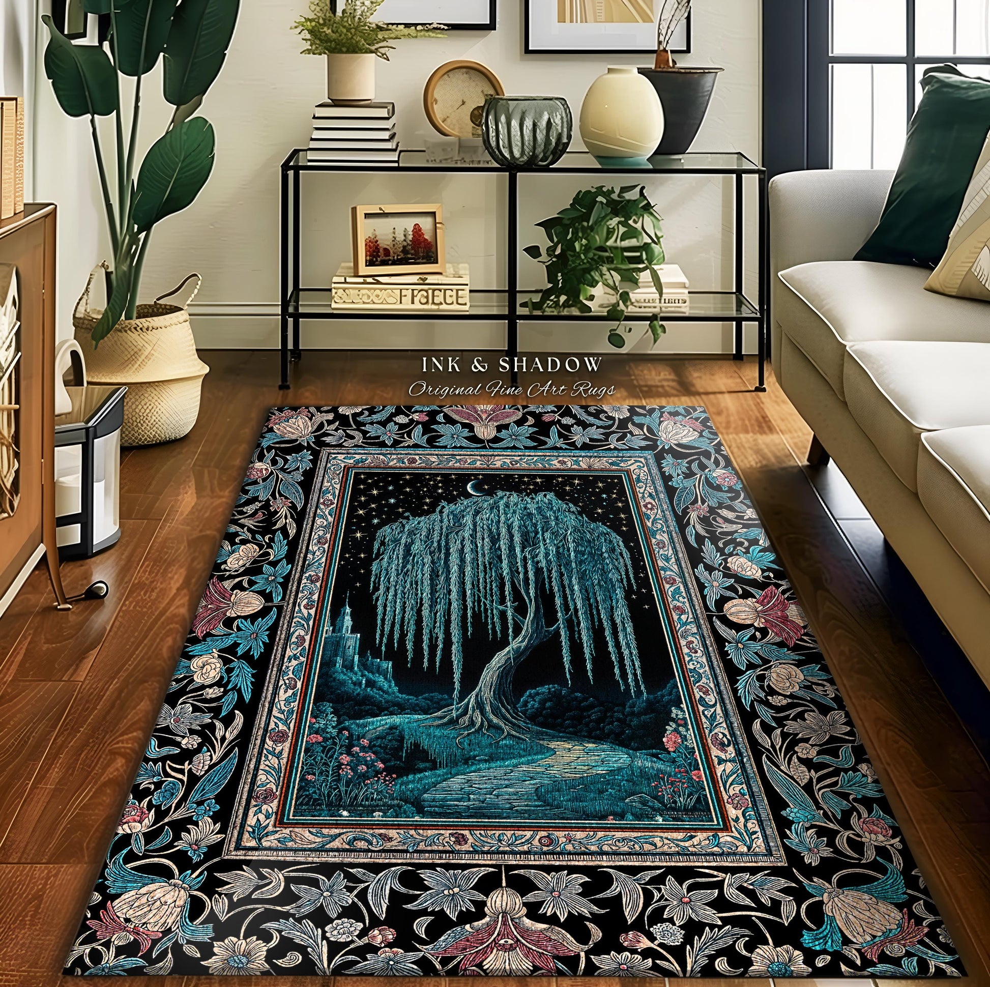 May include: A black and teal area rug with a floral border. The center of the rug features a willow tree with a crescent moon in the background. The rug has the text &#39;Ink & Shadow Original Fine Art Rugs&#39; in the top center.