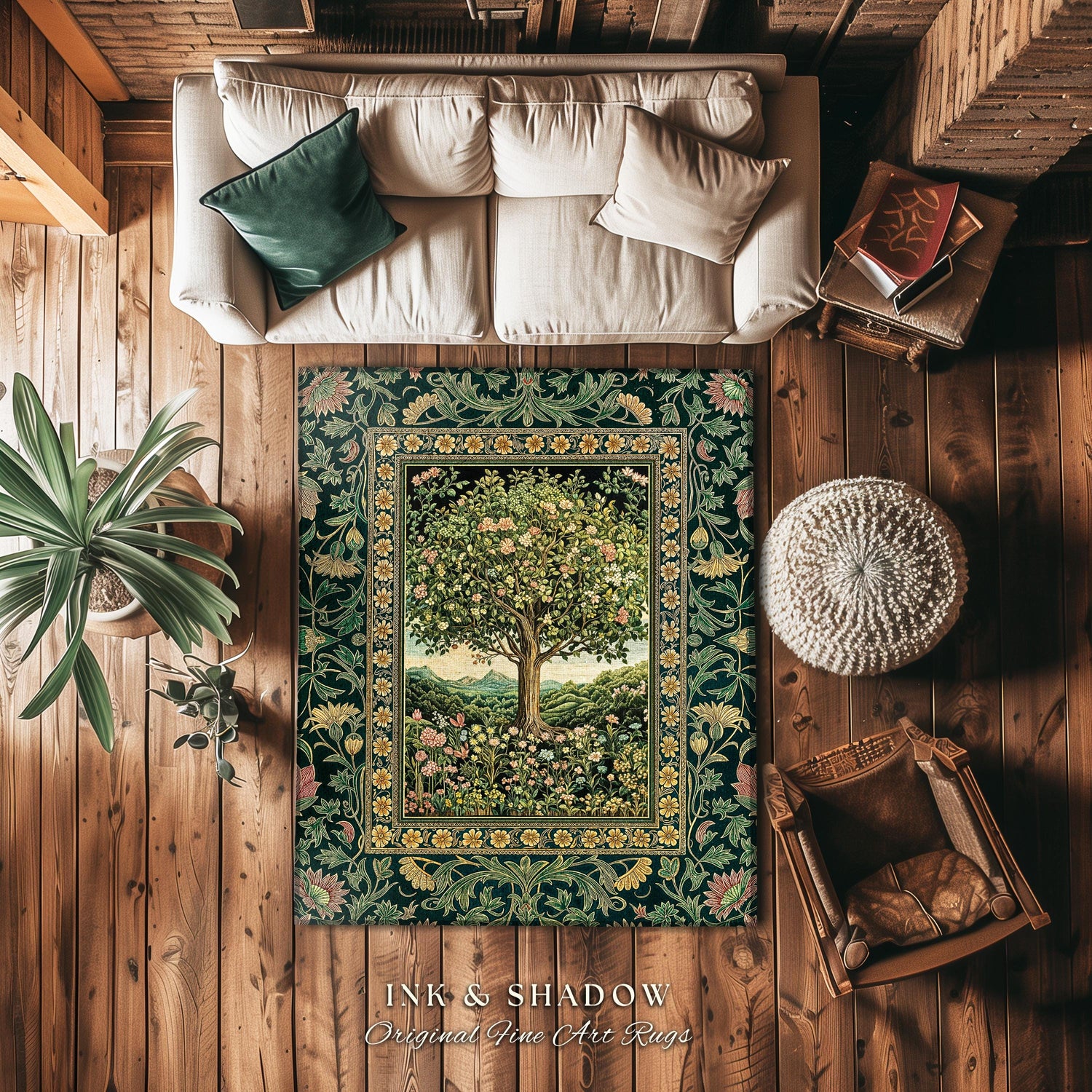 May include: A green and gold rug with a floral design and a tree in the center. The rug is on a wooden floor with a white couch, a brown chair, and a white ottoman. The rug has the text &#39;INK & SHADOW Original Fine Art Rugs&#39; at the bottom.