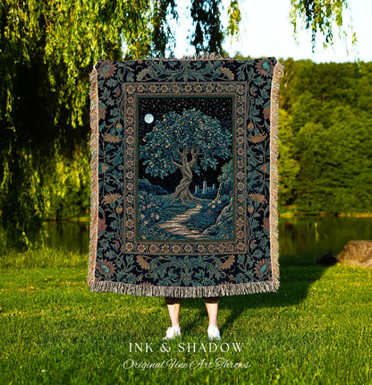 May include: A tapestry throw blanket featuring a detailed illustration of a tree under a starry night sky with a full moon. The blanket has a dark background with floral borders and fringe. The text "INK & SHADOW Original Fine Art Throws" is at the bottom.