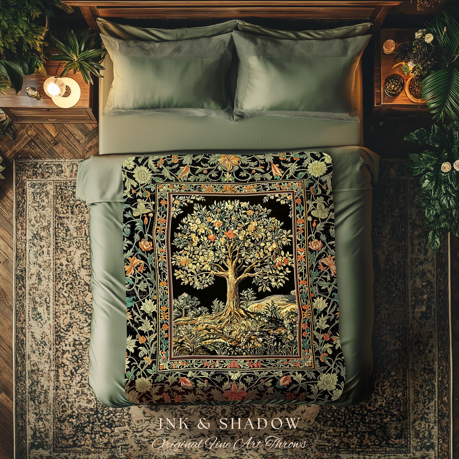 May include: A decorative throw blanket with a tree design on a black background. The tree has golden leaves and is framed by a floral border with orange, green, and yellow accents. The blanket is displayed on a bed with green bedding.