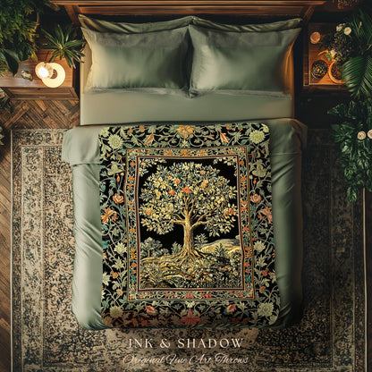 May include: A decorative throw blanket with a tree design on a black background. The tree has golden leaves and is framed by a floral border with orange, green, and yellow accents. The blanket is displayed on a bed with green bedding.