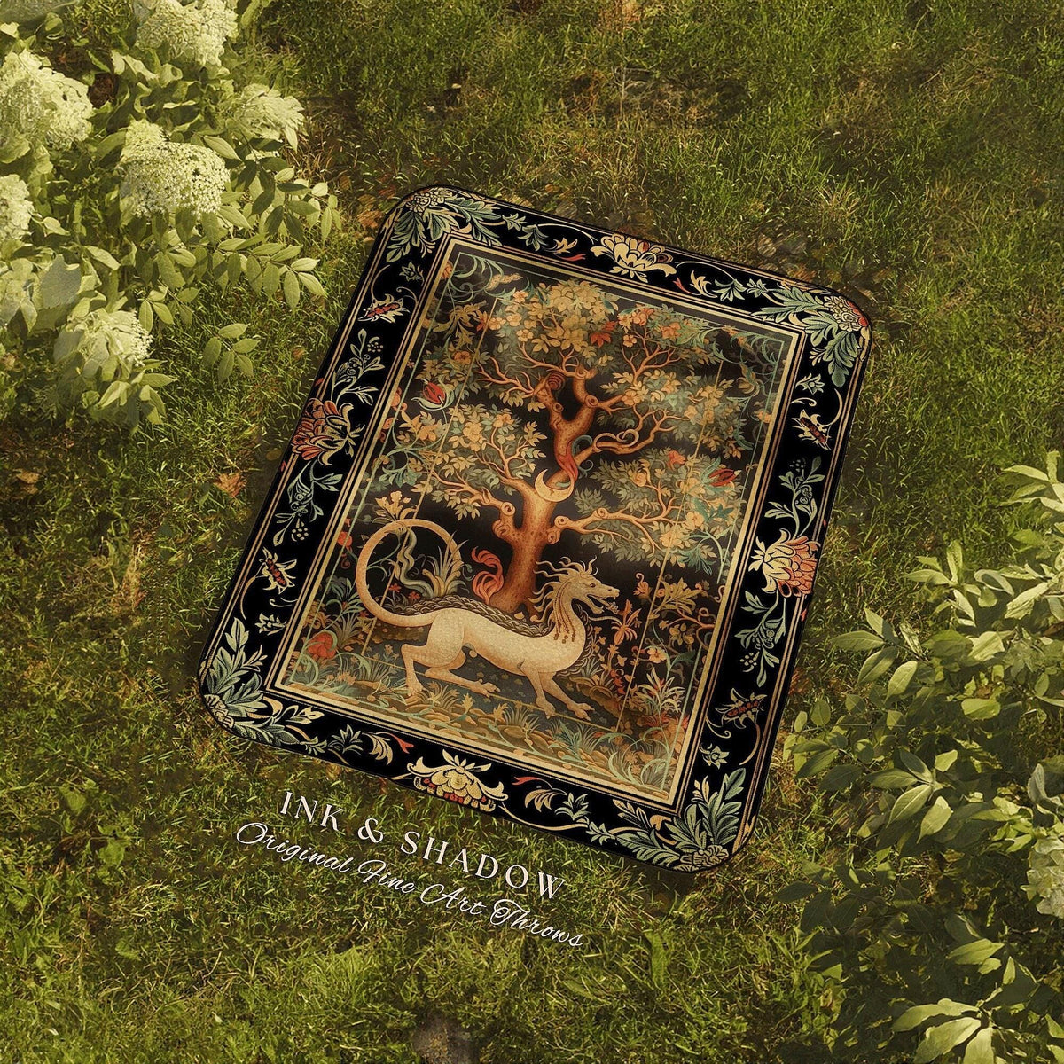 a book laying on top of a lush green field