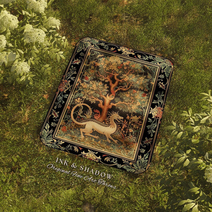 a book laying on top of a lush green field