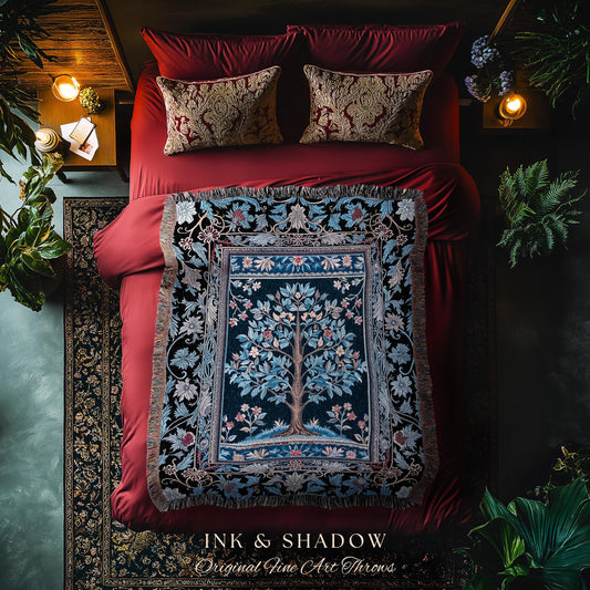 May include: A decorative throw blanket with a tree of life design, in shades of blue, green, and brown, is displayed on a red bed. The blanket is fringed and has a detailed floral border. The text "INK & SHADOW Original Fine Art Throws" is at the bottom.