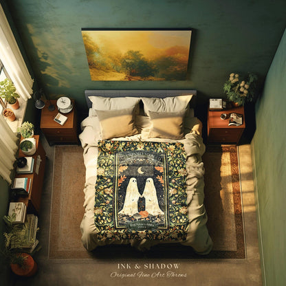 May include: A green and black tapestry throw blanket with a floral design. The blanket features two white ghosts holding hands with a pumpkin in the center. The text on the blanket reads 'Eternally Yours' and 'Dylan & Gabby 2023'. The blanket is displayed on a bed with white and brown pillows.