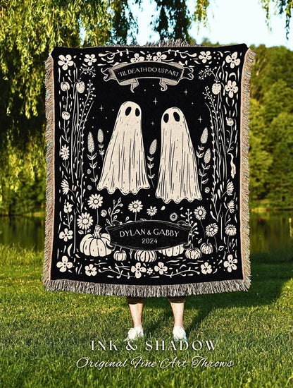 May include: Black throw blanket with a whimsical design featuring two ghost figures, flowers, and pumpkins. The text "'TIL DEATH DO US PART" is at the top, with "DYLAN & GABBY 2024" below. The blanket has a fringed edge and the words "INK & SHADOW Original Fine Art Throws" at the bottom.