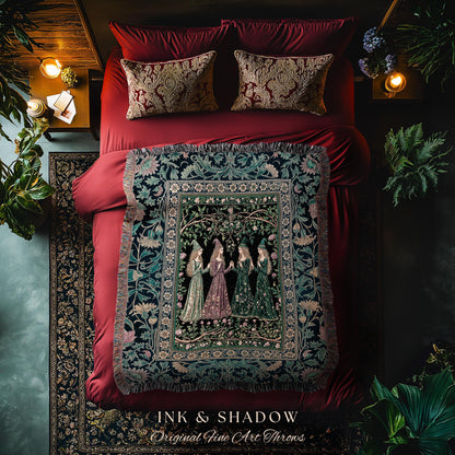 May include: A bed with red bedding, patterned pillows, and a decorative throw blanket. The throw features a detailed illustration of women in gowns. The text "INK & SHADOW Original Fine Art Throws" is at the bottom.