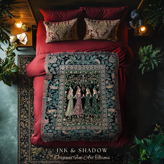 May include: A bed with red bedding, patterned pillows, and a decorative throw blanket. The throw features a detailed illustration of women in gowns. The text "INK & SHADOW Original Fine Art Throws" is at the bottom.