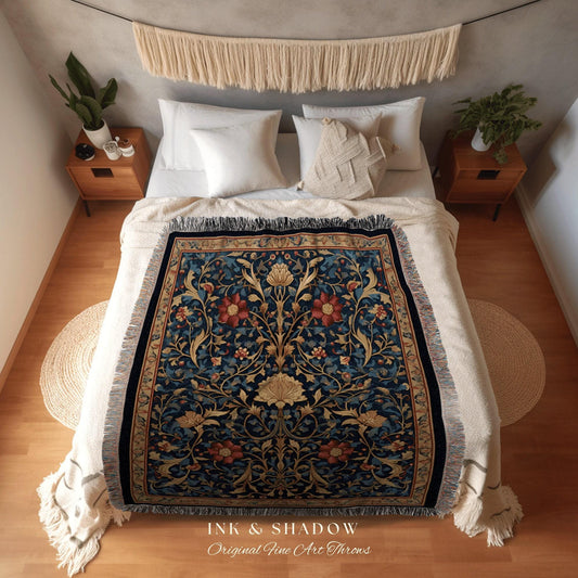 May include: A decorative throw blanket with a floral pattern in shades of blue, red, and gold, displayed on a bed. The blanket features a detailed botanical design and fringe edges. The text "INK & SHADOW Original Fine Art Throws" is visible.