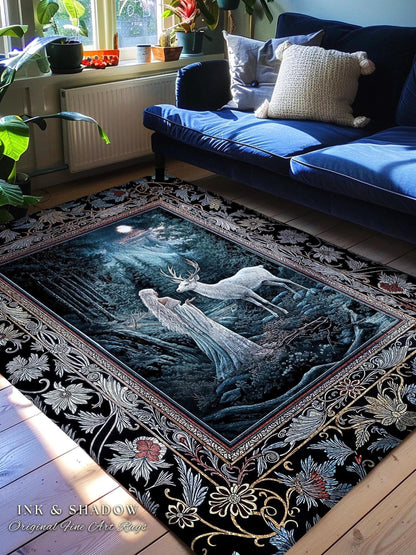 May include: A black and gold rug with a detailed floral border. The center of the rug features a dark blue background with a white figure and a white deer standing in a forest setting. The text "INK & SHADOW Original Fine Art Rugs" is at the bottom of the rug.