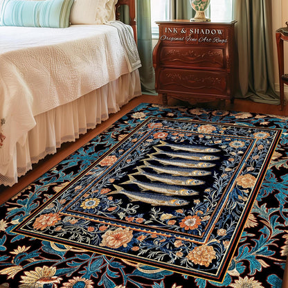 May include: A rectangular area rug with a dark background and a repeating floral pattern in shades of blue, orange, and cream. The center features six fish. The rug has a border with a similar floral design. The text "INK & SHADOW Original Fine Art Rugs" is visible.