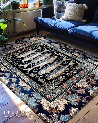 May include: A rectangular area rug with a black center featuring five fish illustrations. The rug has a dark blue floral border and the text "INK & SHADOW Original Fine Art Rugs". The rug is placed on a wooden floor near a blue sofa.