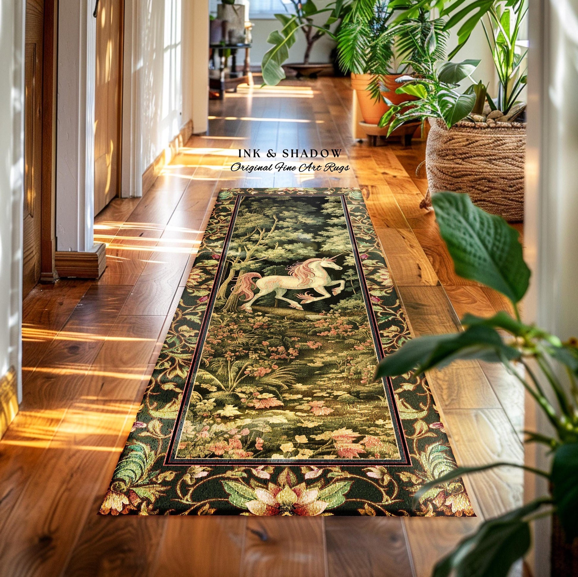 May include: A dark green and gold tapestry runner rug features a unicorn in a forest scene.  The rug has a detailed floral border.  The text 'INK & SHADOW Original Fine Art Rugs' is visible. The rug is displayed on a hardwood floor in a hallway setting.