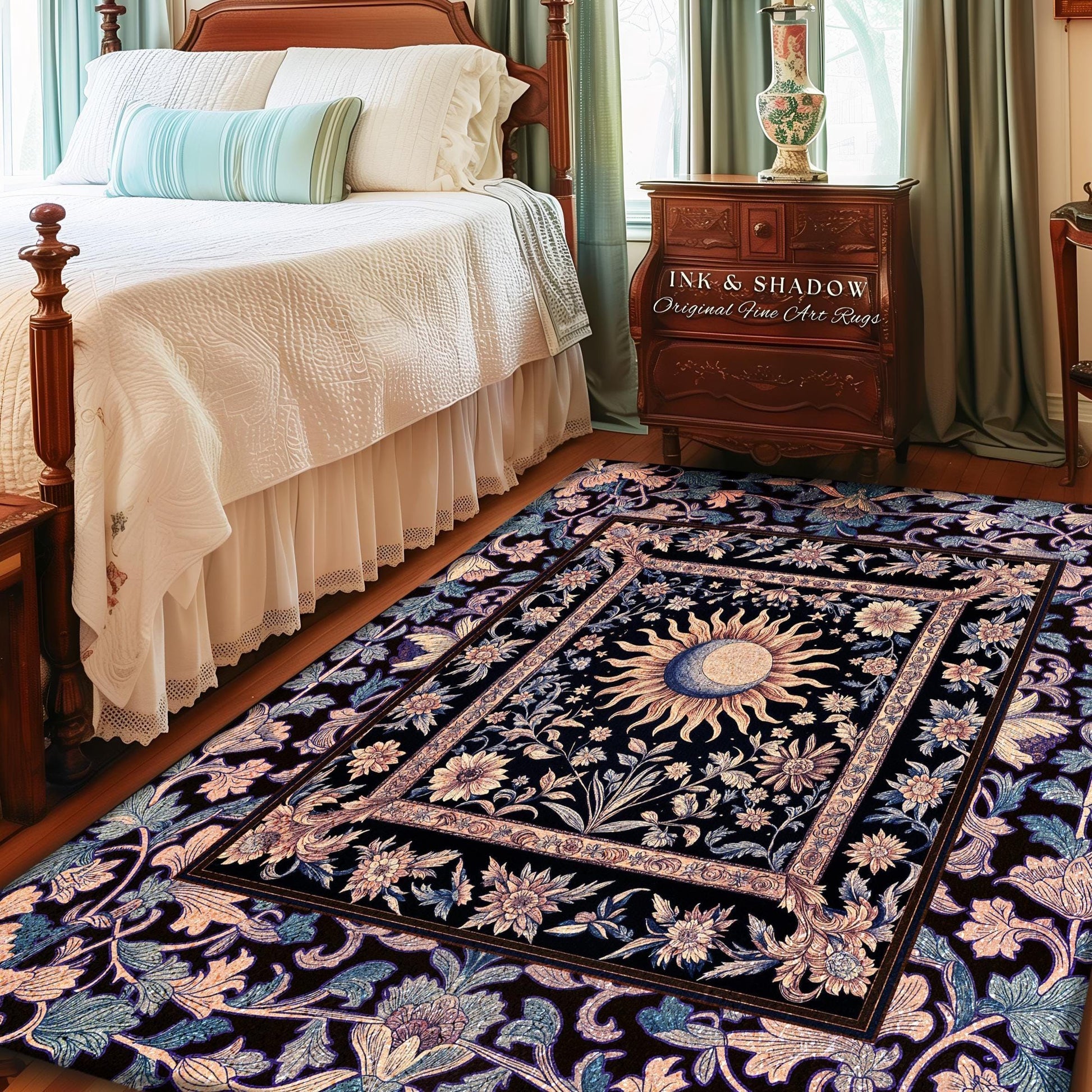 May include: A black and white rug with a floral design and a sun and moon in the center. The rug is in a bedroom with a white bed, a wooden nightstand, and a lamp. The nightstand has a sign that reads 'INK & SHADOW Original Fine Art Rugs'.