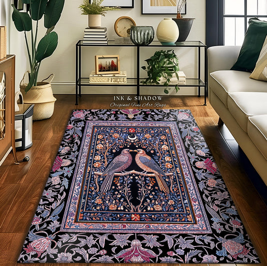 May include: A rectangular area rug with a black background and a central design featuring two birds perched on a branch. The birds are facing each other, with a crescent moon above them. The rug has a floral border in shades of blue, pink, and purple. The text 'INK & SHADOW Original Fine Art Rugs' is visible.