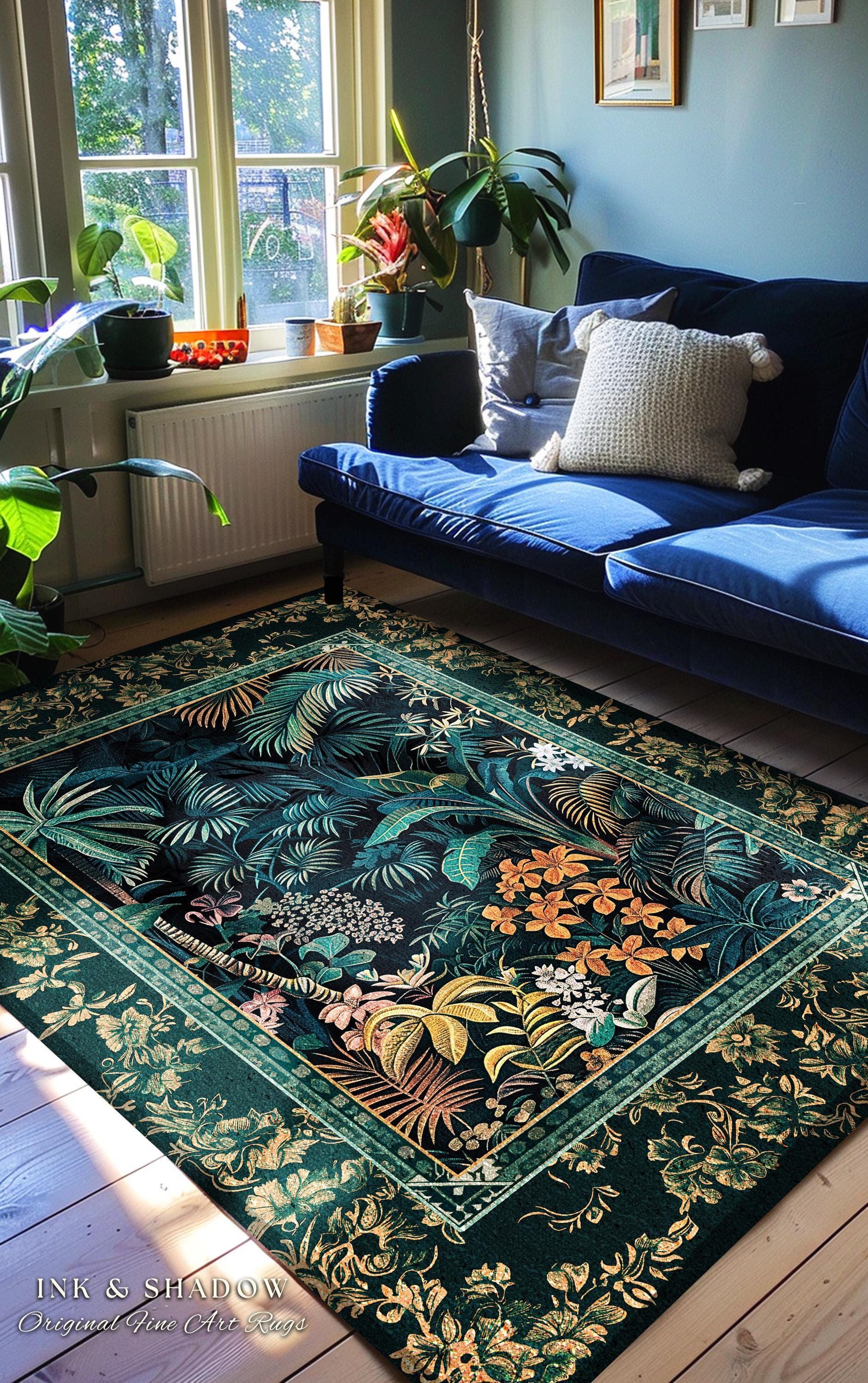 May include: A rectangular rug with a dark green background and a tropical leaf pattern. The rug features a border with floral designs and the text "INK & SHADOW Original Fine Art Rugs". A blue sofa and window are in the background.