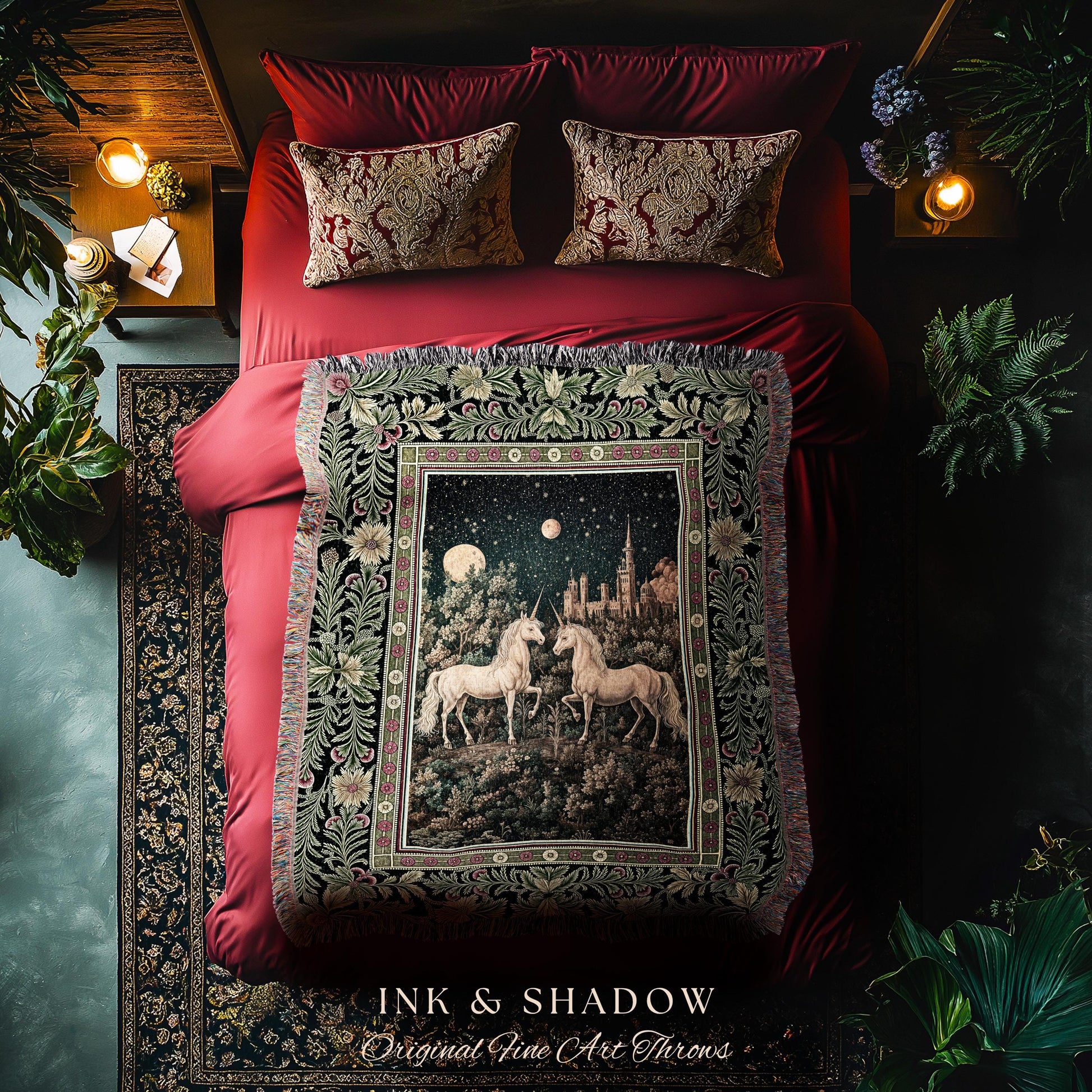 May include: A red bed with matching pillows and a decorative throw blanket. The throw features a night scene with two white unicorns, a castle, and a starry sky. The blanket is framed by a floral border and the text "INK & SHADOW Original Fine Art Throws".