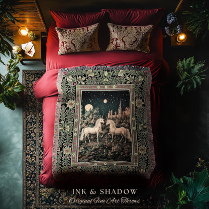 May include: A red bed with matching pillows and a decorative throw blanket. The throw features a night scene with two white unicorns, a castle, and a starry sky. The blanket is framed by a floral border and the text "INK & SHADOW Original Fine Art Throws".