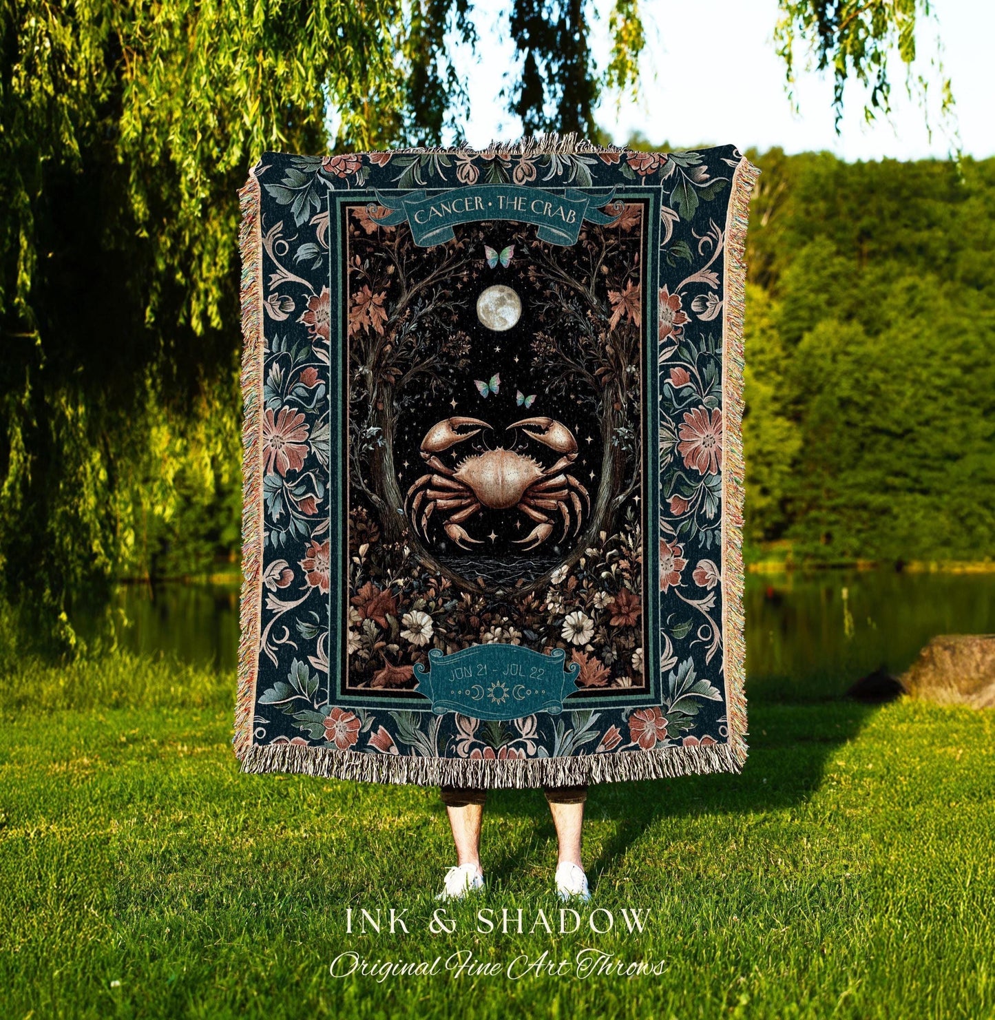May include: A dark blue throw blanket with a Cancer the Crab design. The blanket features a crab illustration surrounded by floral and celestial elements. The text "CANCER - THE CRAB" is at the top, with "INK & SHADOW Original Fine Art Throws" at the bottom.