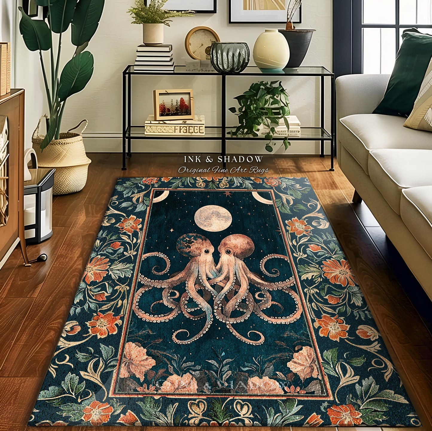 May include: A teal blue rug with an intricate floral border. The center of the rug features a pair of stylized octopuses with a full moon in the background. The rug has the text 'Ink & Shadow Original Fine Art Rugs' at the top.