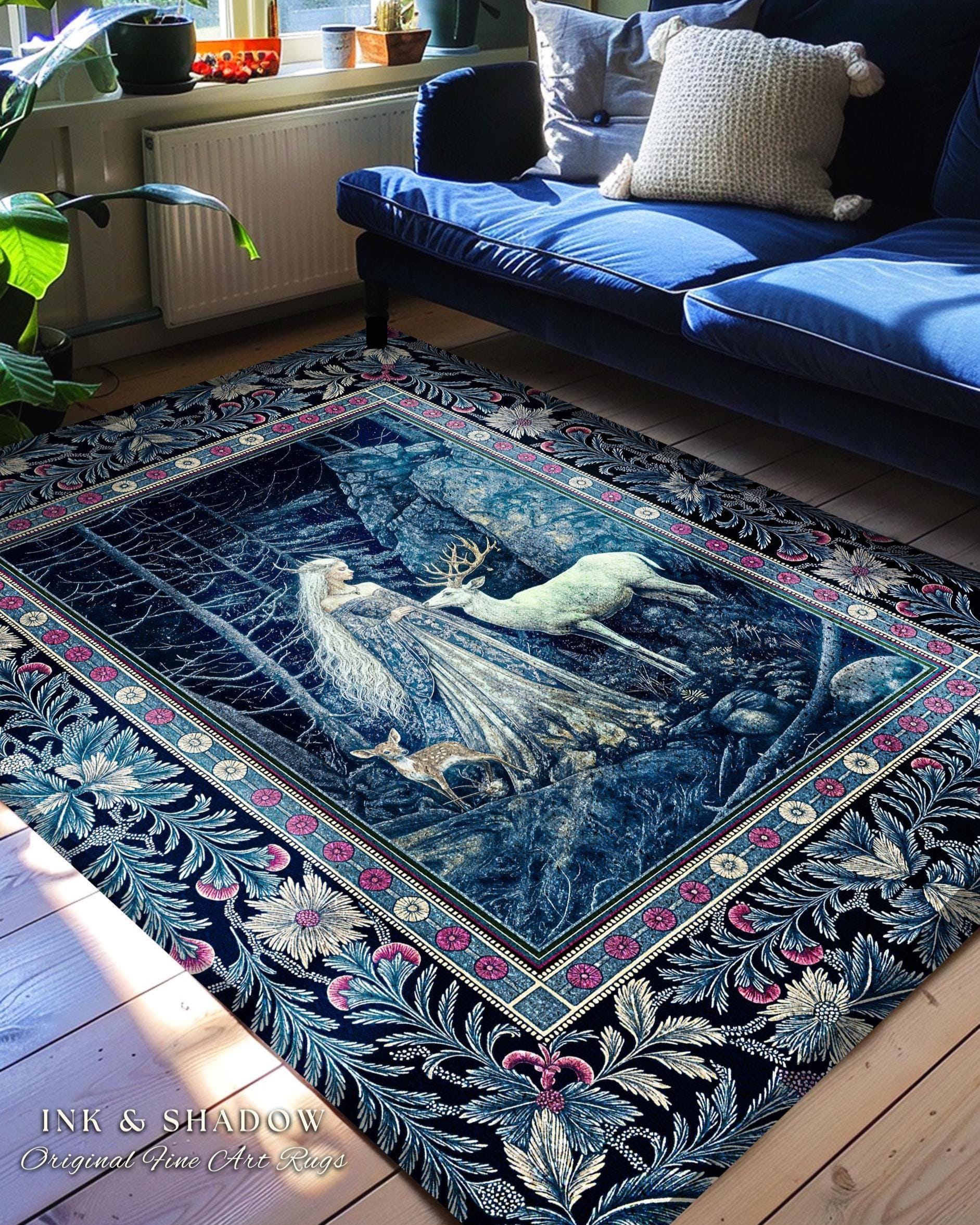 May include: A blue and white rug with a floral border and a scene of a woman and a deer in a forest. The rug is on a wooden floor in a living room with a blue sofa and plants.