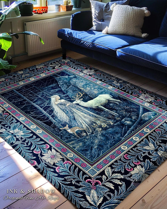 May include: A blue and white rug with a floral border and a scene of a woman and a deer in a forest. The rug is on a wooden floor in a living room with a blue sofa and plants.