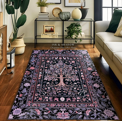May include: A rectangular area rug with a black background and a central tree design. The tree is surrounded by floral and leaf patterns in shades of pink, purple, and white. The rug has a decorative border and the text "INK & SHADOW Original Fine Art Rugs".