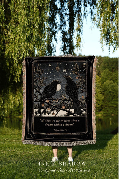 May include: Black throw blanket featuring two crows perched on a branch under a starry night sky with a full moon. The blanket has a quote from Edgar Allan Poe and the words "INK & SHADOW Original Fine Art Throws".