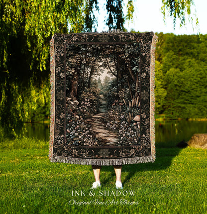 May include: A black throw blanket with a detailed forest scene, featuring a stone path winding through trees and flowers. The blanket has a decorative border and fringe. The text "INK & SHADOW Original Fine Art Throws" is at the bottom.