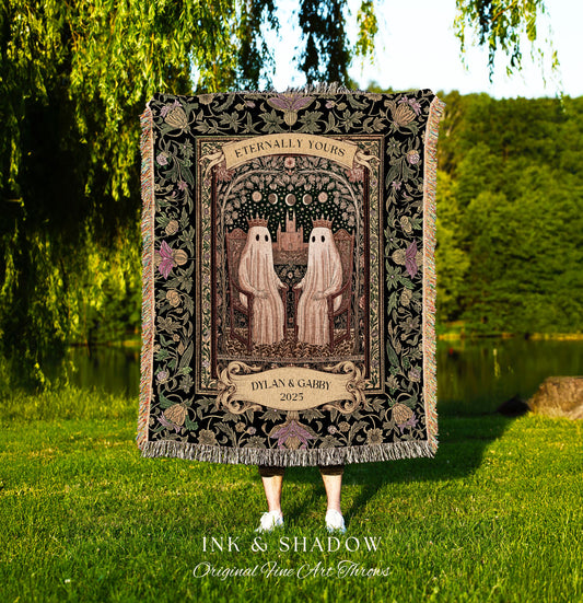May include: A black throw blanket with a decorative floral border and fringe. The center features two ghost figures holding hands under an arch with the words "Eternally Yours". Below is a banner with the names "Dylan & Gabby" and the year "2025".