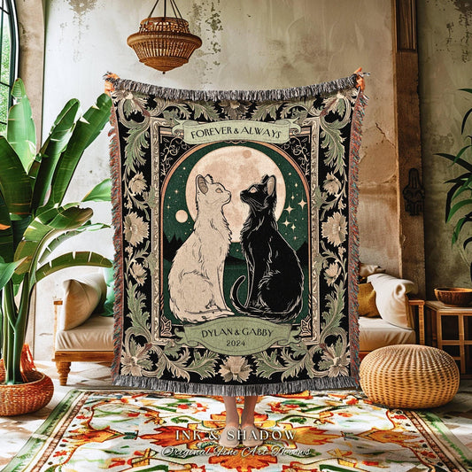 May include: A woven throw blanket featuring a black and white cat design under a full moon. The blanket has a decorative border with the words "Forever & Always" and "Dylan & Gabby 2024". The blanket is fringed.