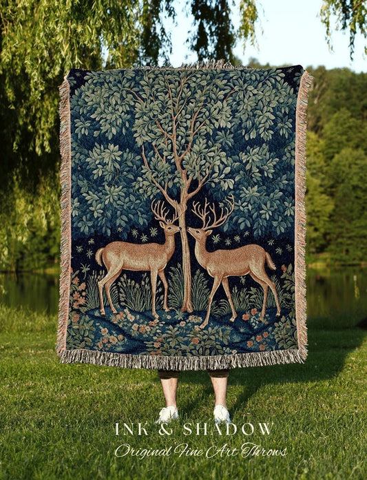 May include: A dark blue throw blanket featuring a tree and two deer facing each other. The blanket has a fringed edge and the text "INK & SHADOW Original Fine Art Throws" at the bottom.